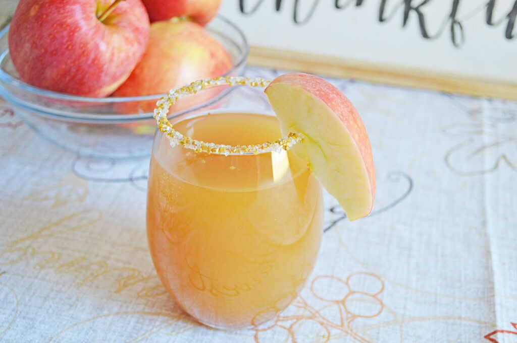 apple cider mimosa with apple garnish